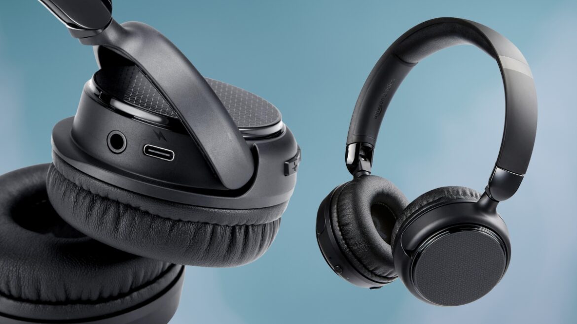 Close-up of Amazon Basics Bluetooth headphones showing the foldable design, ear cushions, and USB-C charging port.