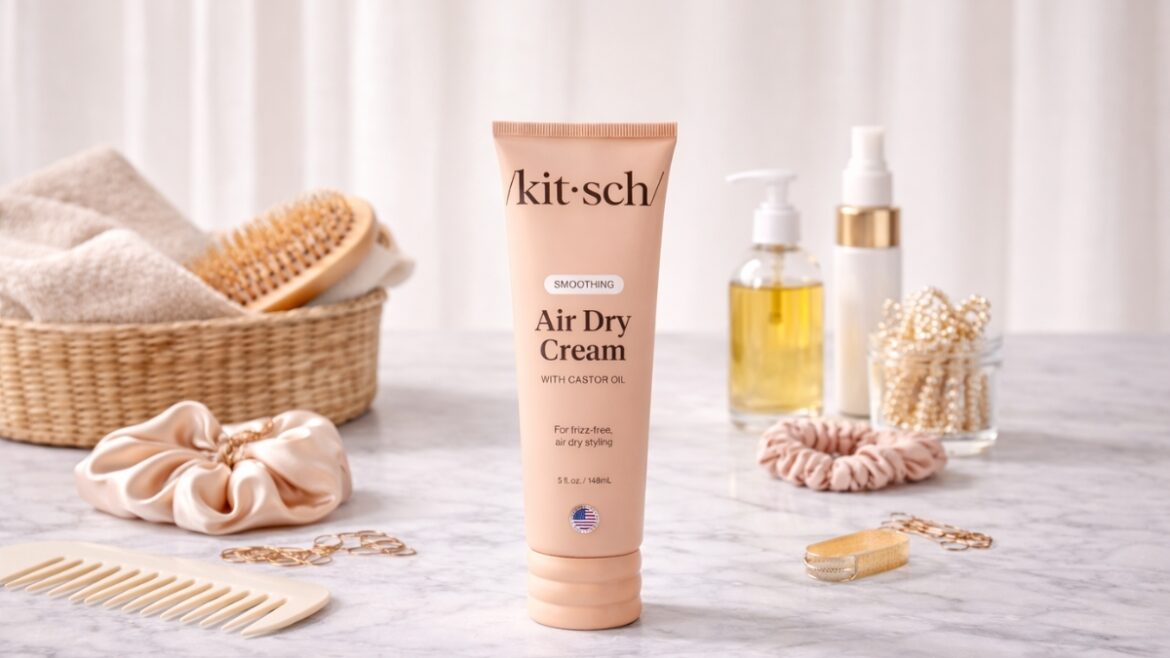 Kitsch Smoothing Air Dry Cream standing on a marble counter with hair accessories and styling tools