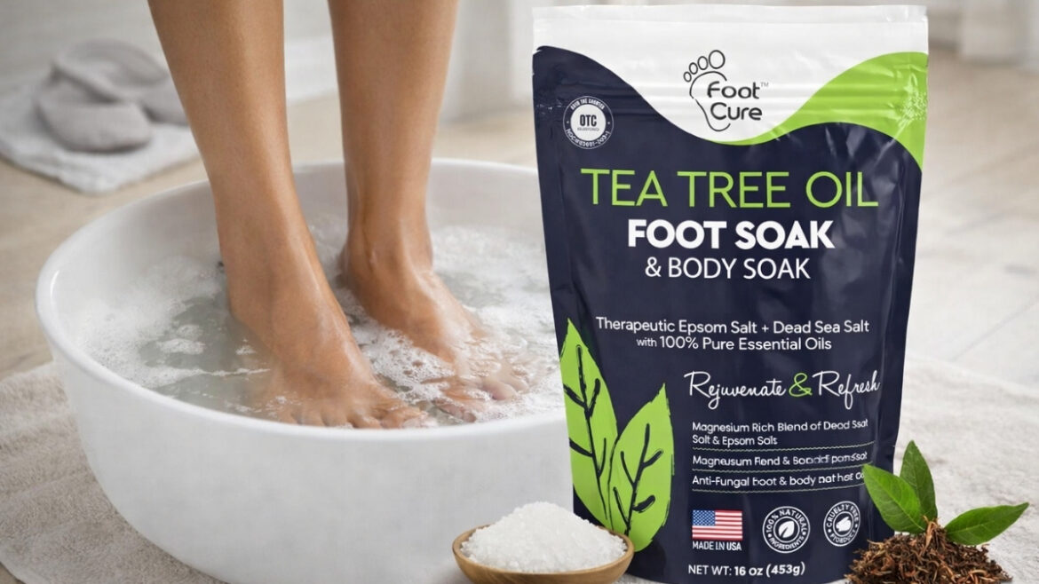 FOOT CURE Tea Tree Oil Foot Soak with feet soaking in Epsom salt basin