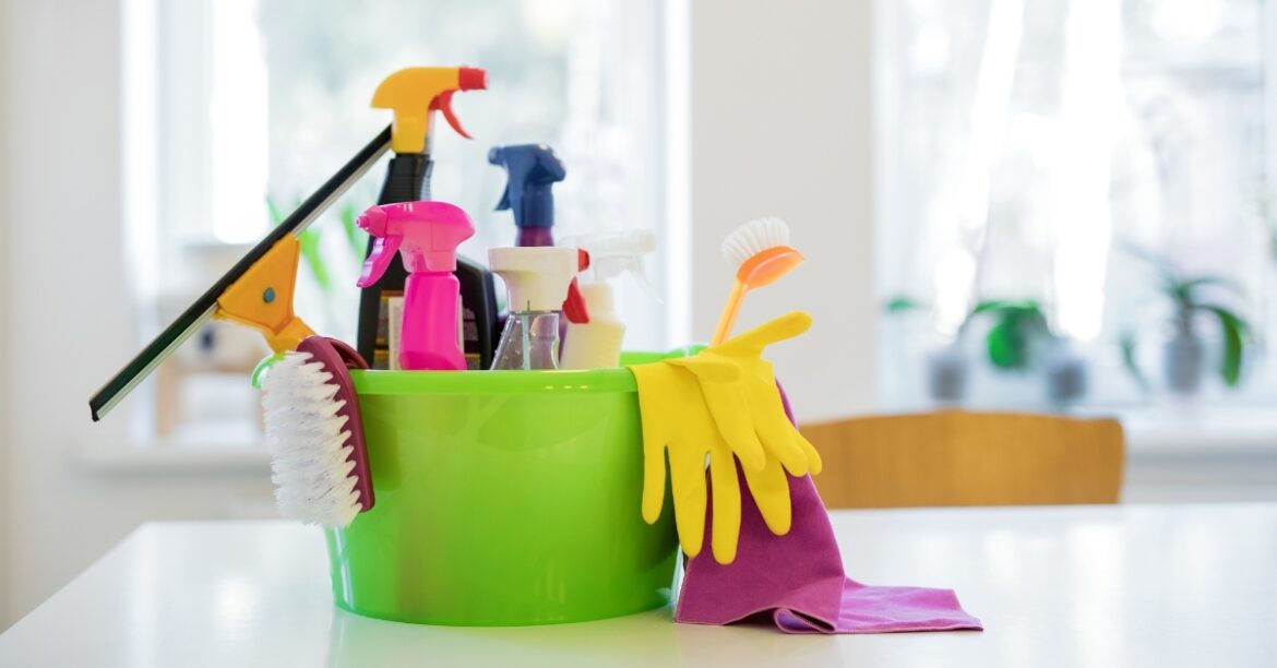 Colorful bucket of cleaning supplies featured in an Ultimate Amazon Cleaning Tools Haul setup