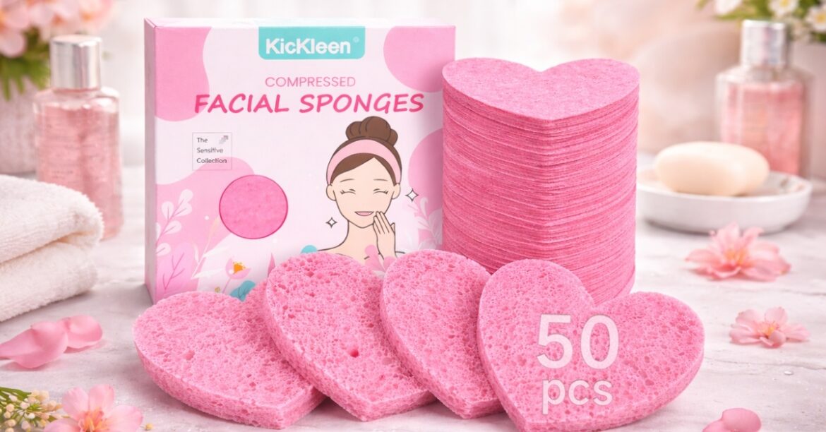 Kickleen Compressed Heart-Shaped Facial Sponges in pink, natural cellulose facial sponges stacked beside retail packaging